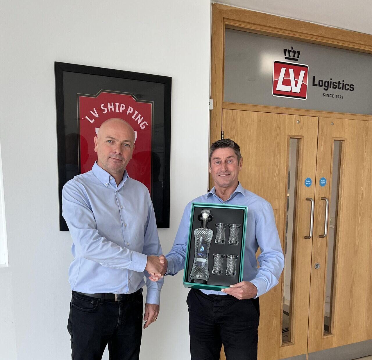 Paul Gardiner presenting a commemorative gift to LV Logistics UK